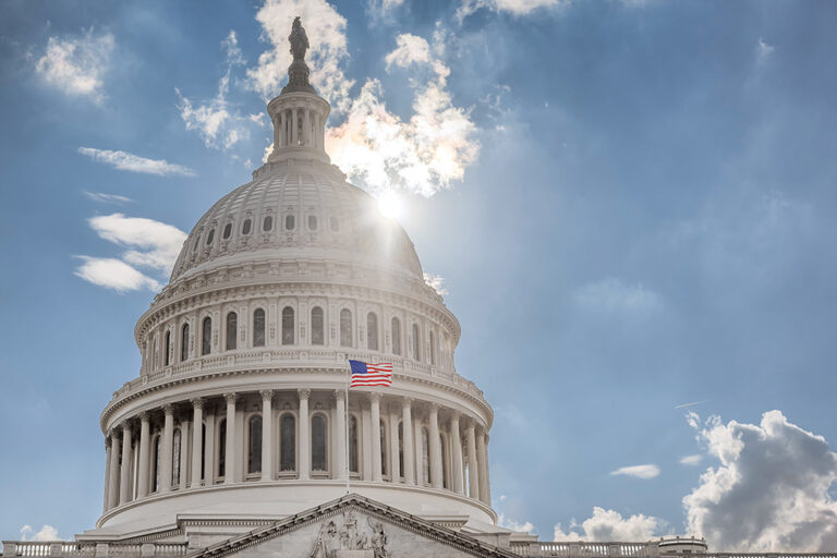 U.S. Capitol dome against blue sky