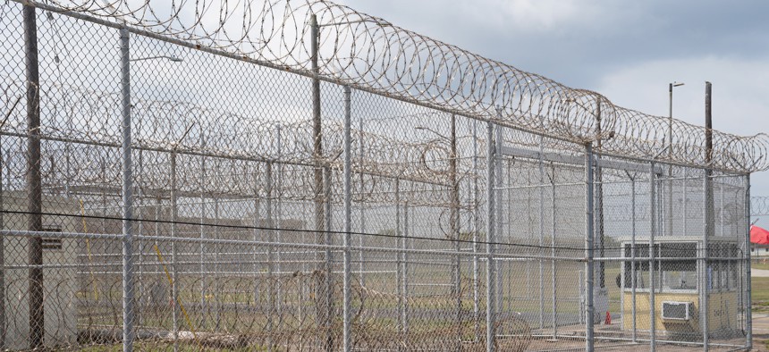 Chain-link fence with razor wire at a detention facility