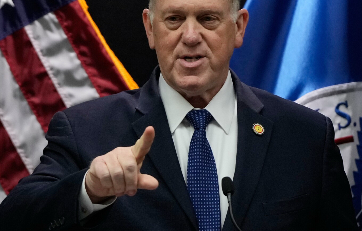 Tom Homan speaking at a podium