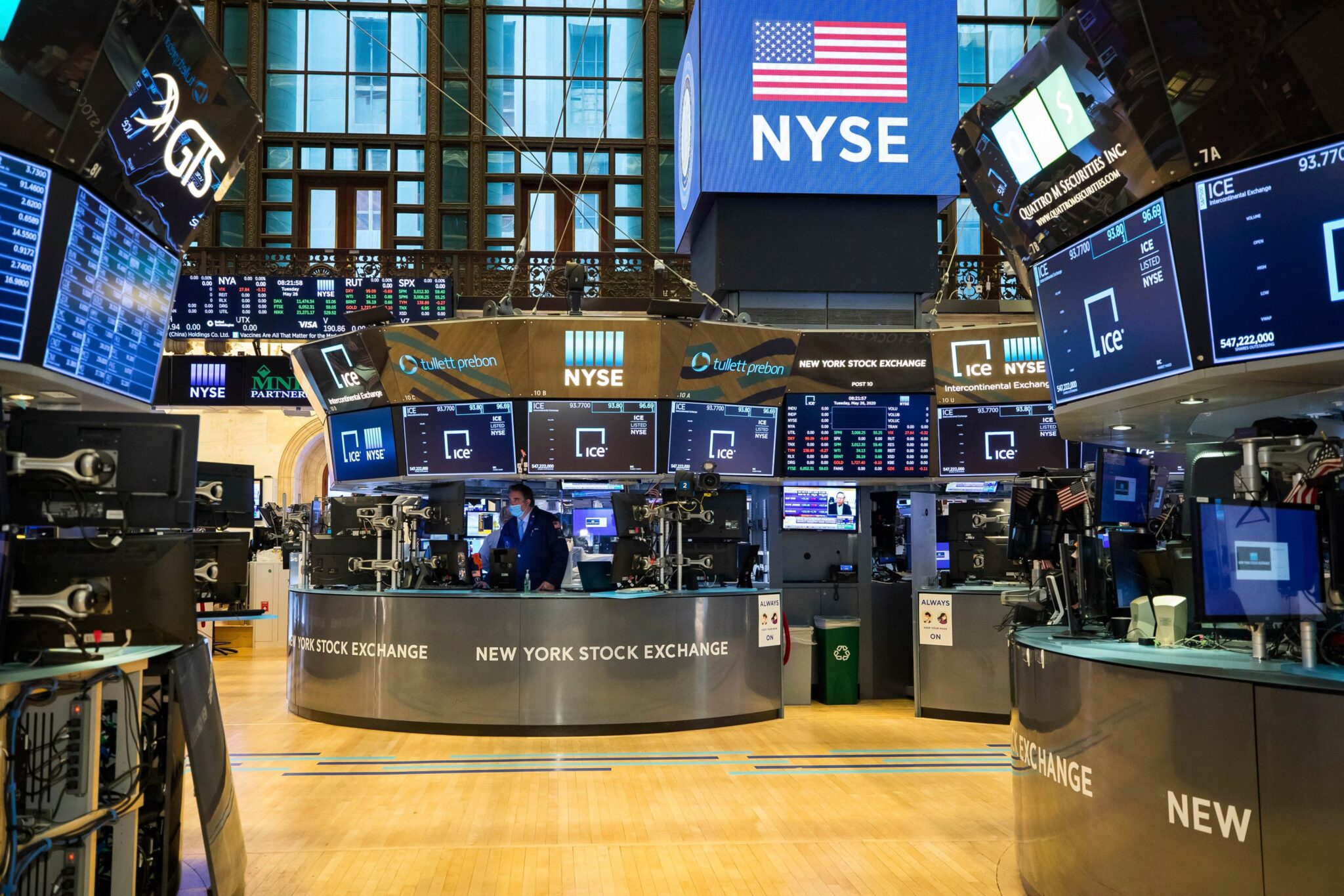 NYSE trading floor with screens