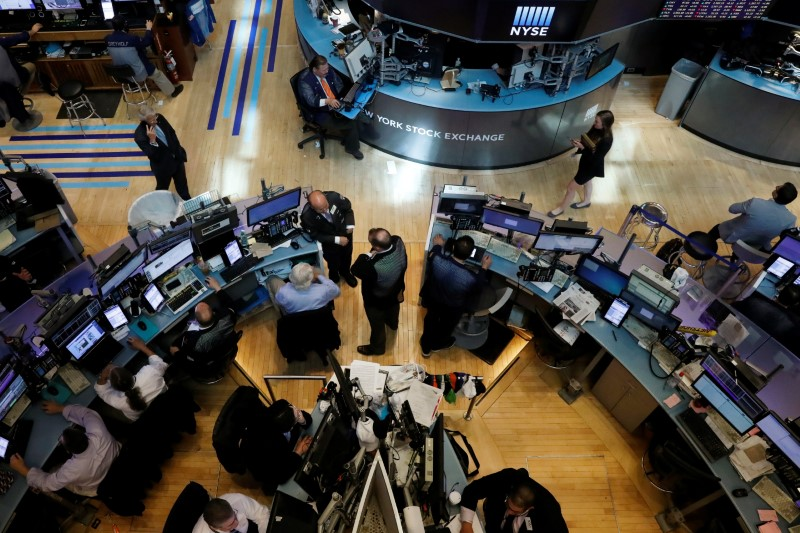 File photo: Stock exchange trading floor with market screens