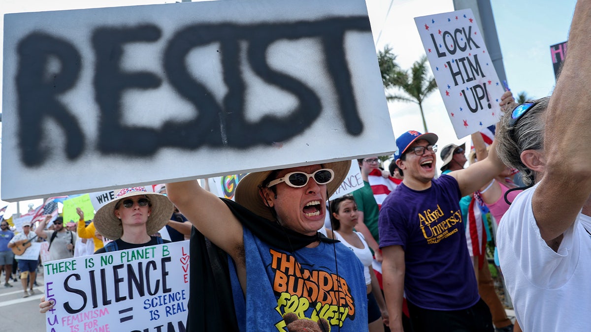 No Kings protest march in Florida with signs