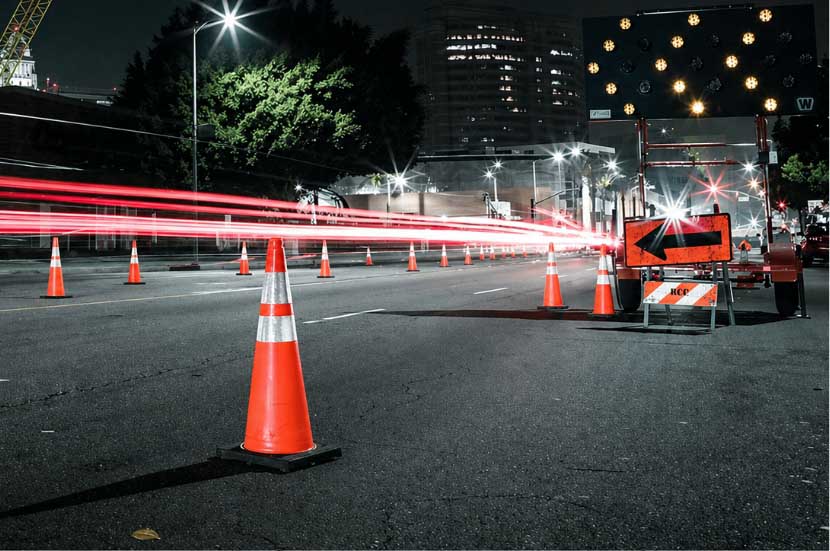 Nighttime roadwork lane closure with traffic cones