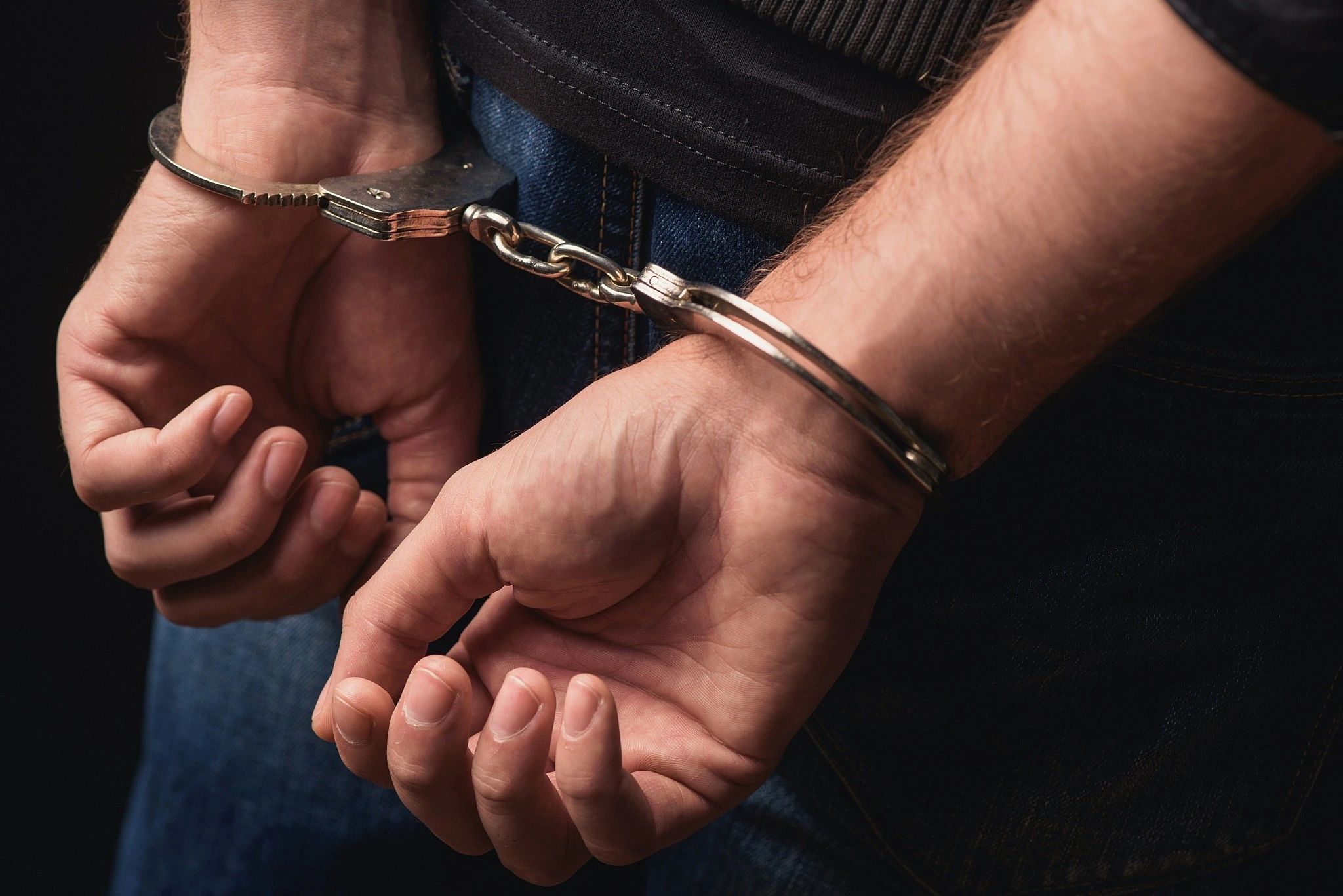 Hands in handcuffs