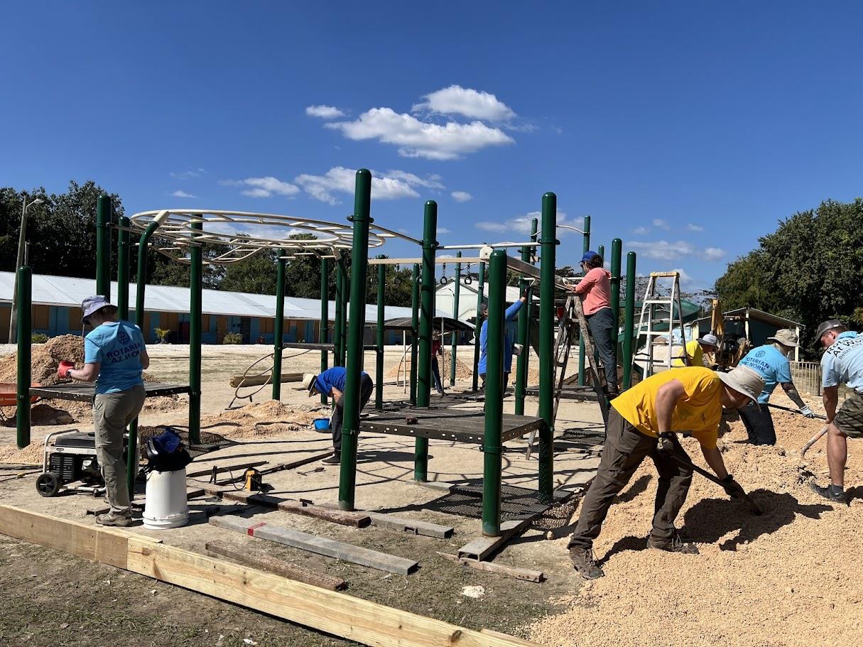volunteers building a playground