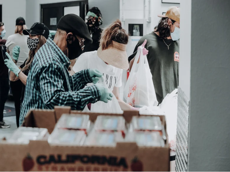 volunteers packing food for people in need