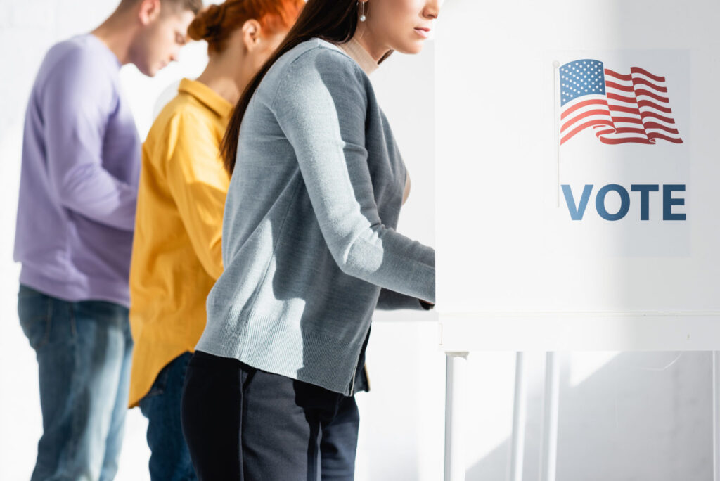 voters casting ballots at a polling place