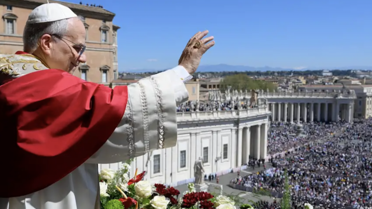 Pope Leo XIV waves to the crowd from the Vatican balcony