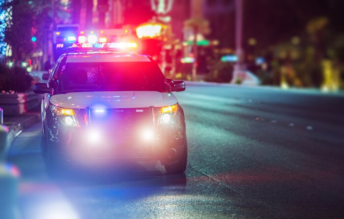 Police cars with lights at night