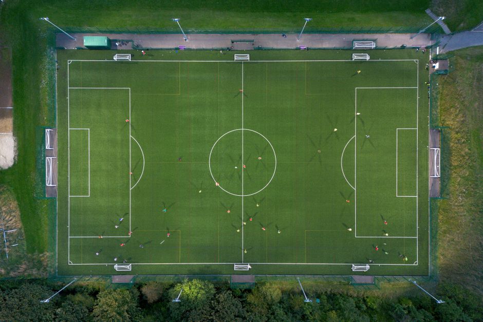 An aerial view of a youth soccer field during a game